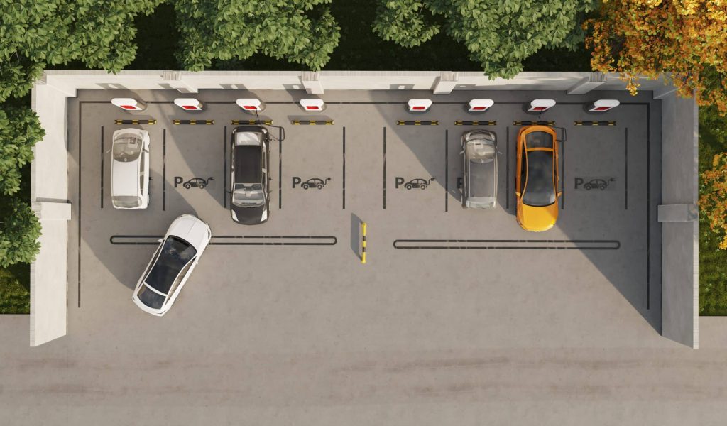 Vue de dessus d'un parking accueillant plusieurs véhicules électriques